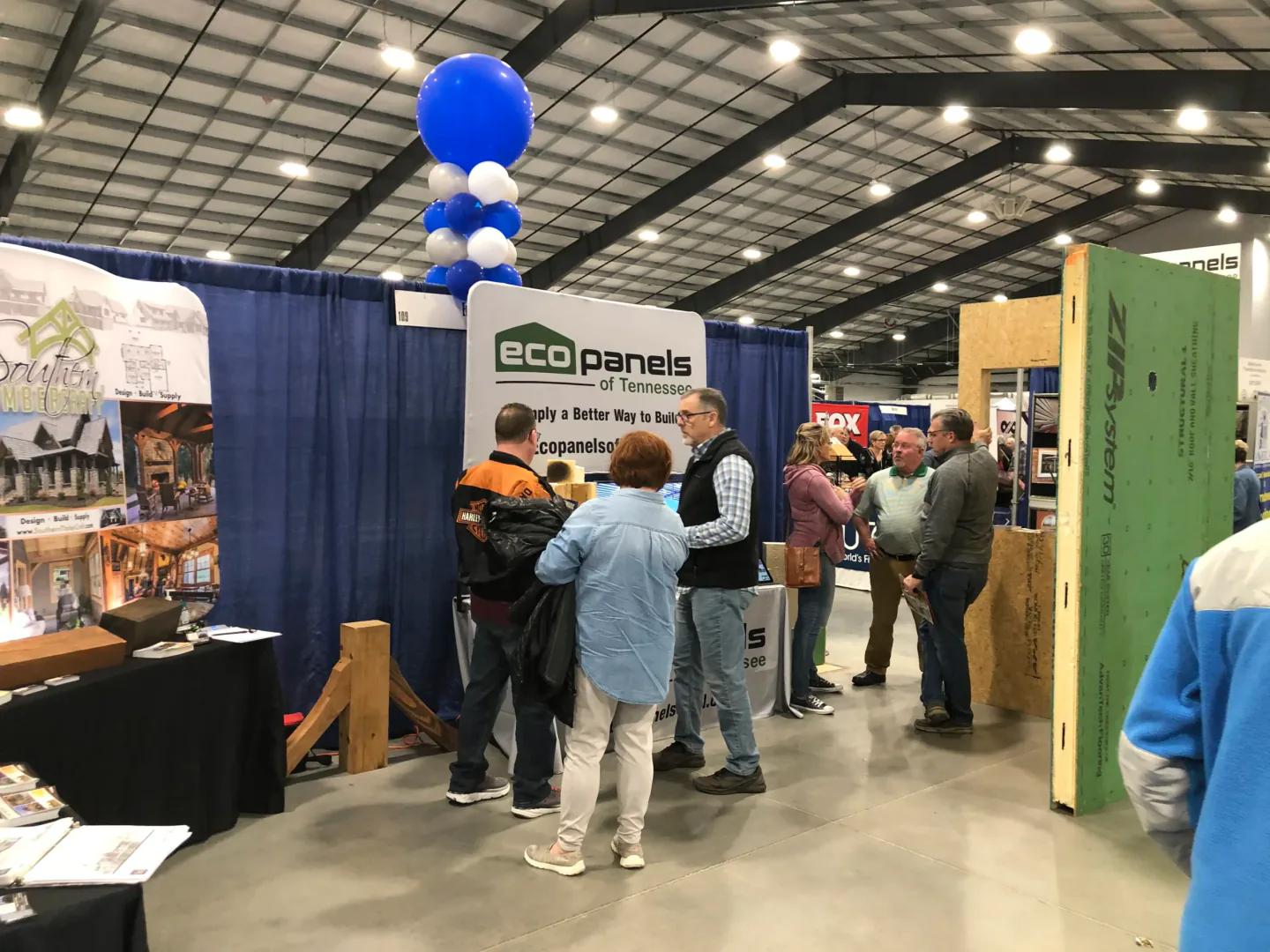 Visitors talking with home building professionals